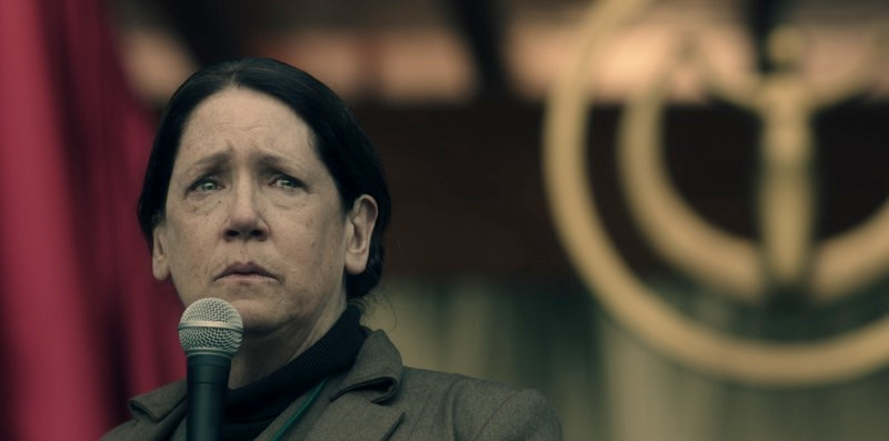 Ann Dowd as Aunt Lydia, one of the women at the Red Center who helps train Handmaids.